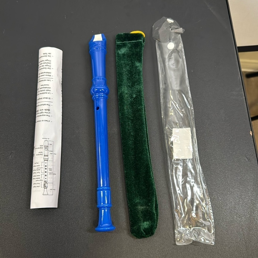 Blue Recorder. For music class. Comes with instructions, cleaning tool, cover.